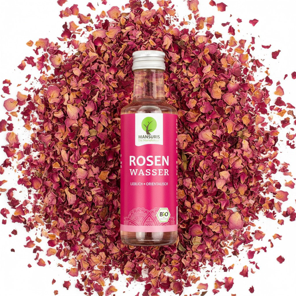 babaGOURMET Mansuris BIO Rosenwasser 100ml glass bottle with pink label, natural rose water for flavoring food and drinks.