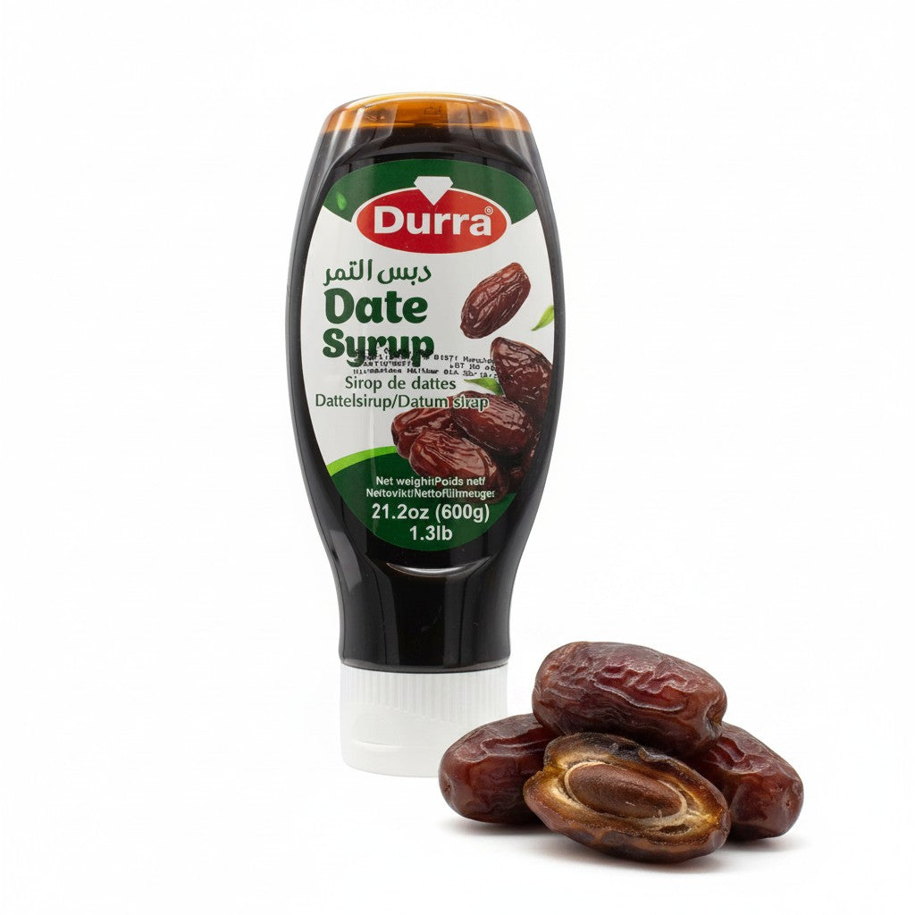 babaGOURMET Durra Date Syrup 600g bottle, a dark, viscous liquid with Arabic and English labels, ideal for cooking and baking.