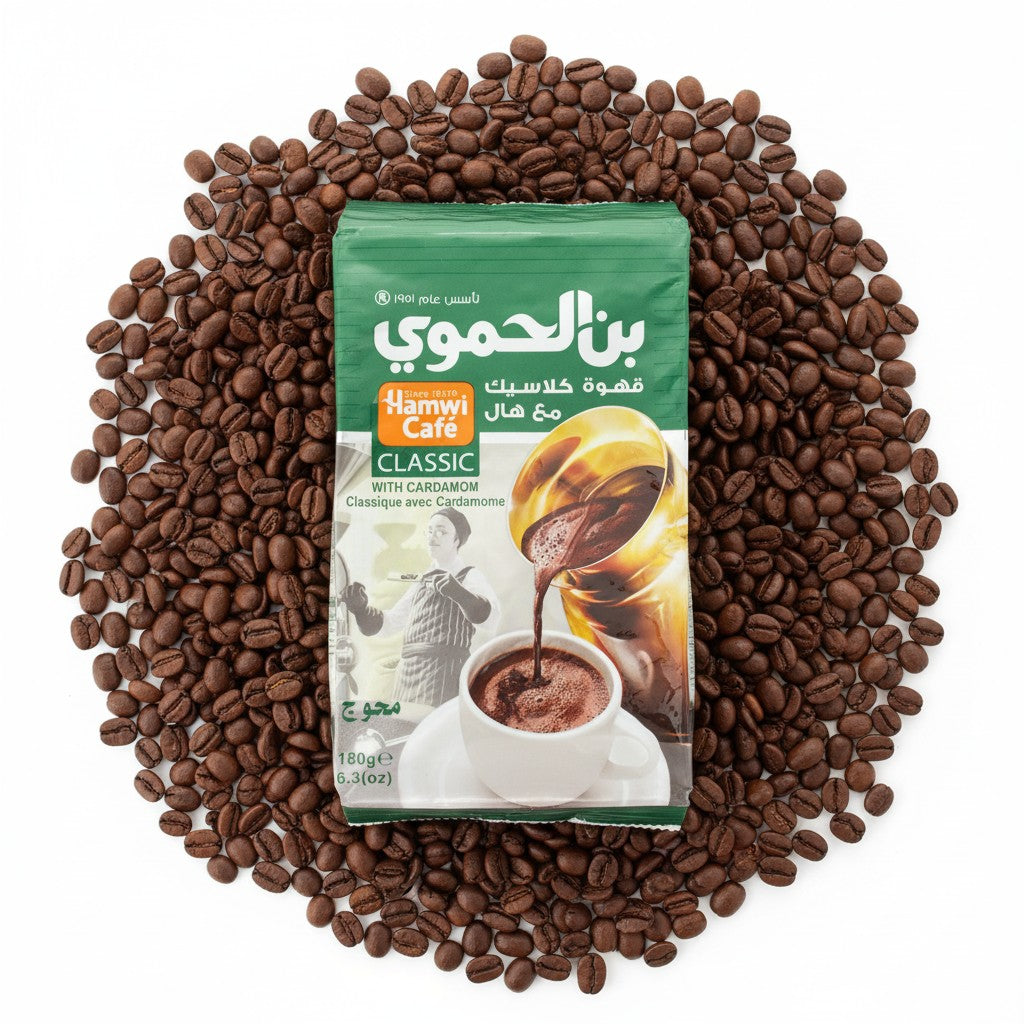 babaGOURMET Hamwi Classic ground Arabic coffee with cardamom, 180g bag. Features a depiction of coffee being poured into a cup.