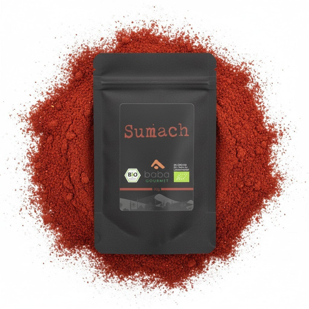 baba GOURMET organic sumac powder, 60g pouch. A dark pouch with a label featuring the brand name, 'Sumach' in red, and organic certifications.